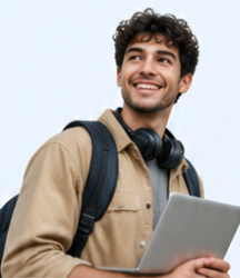 A smiling male student with a backpack holding a laptop